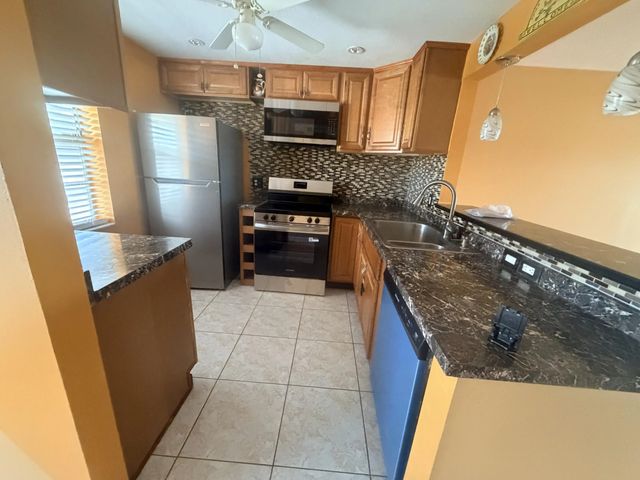 2 of 47 - 1025 Country Club Drive #407, Margate, FL