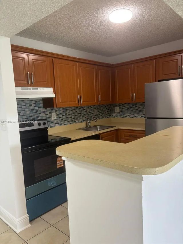 2 of 7 - 7110 Nw 179th Street #211, Hialeah, FL