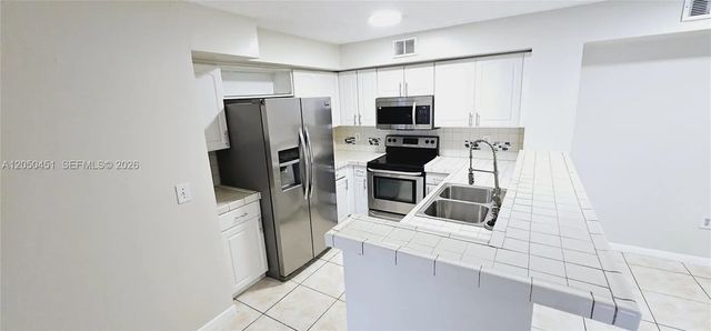 2 of 34 - 1707 Village Boulevard #208, West Palm Beach, FL