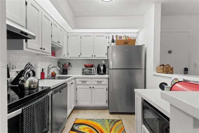 2 of 65 - 9930 S Belfort Circle #105, Tamarac, FL