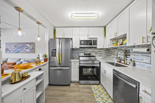 1 of 33 - 200 Village Green Circle E #202, Palm Springs, FL