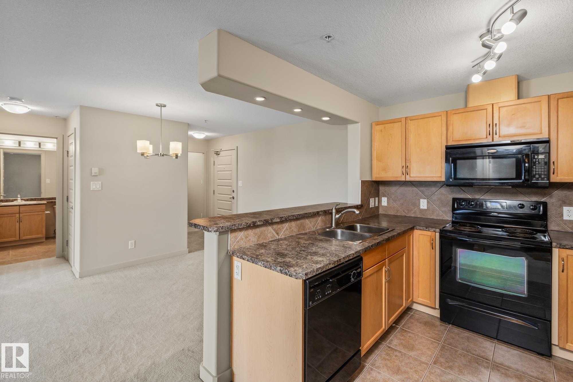 Photo for MLS®# E4462018 - home for sale at 313 11615 Ellerslie Road Southwest, Rutherford (Edmonton), Edmonton AB