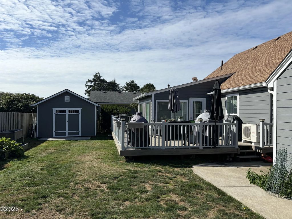 Deck and fenced backyard at 111 NW 58th Street, Newport, Oregon