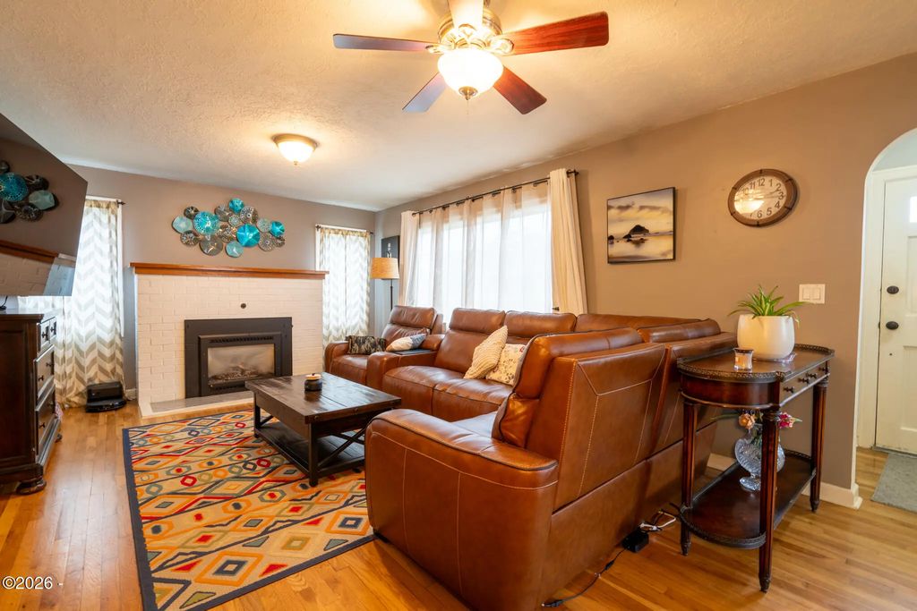 Living room with gas fireplace at 111 NW 58th Street, Newport, Oregon