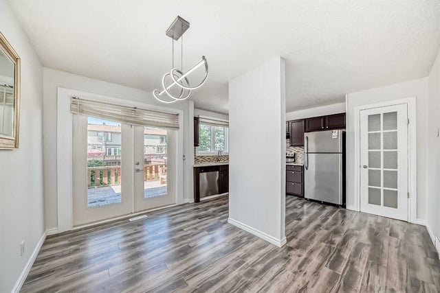 Photo for MLS®# A2239315 - home for sale at 100, 6103 Madigan Drive Northeast, Marlborough Park, Calgary Alberta