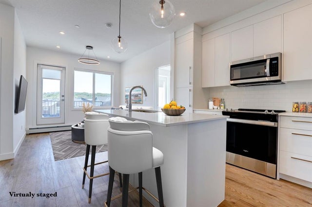 Photo for MLS®# A2244779 - home for sale at 4311, 111 Wolf Creek Drive Southeast, Wolf Willow, Calgary Alberta