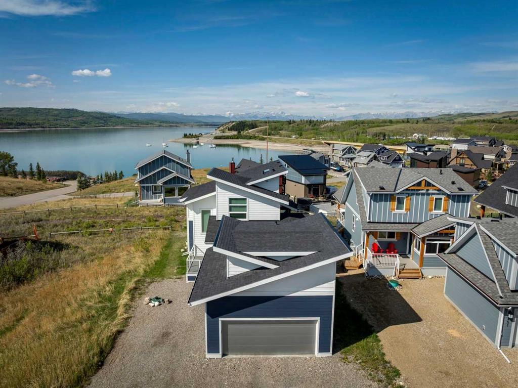 Home for Sale Located at 405 Cottageclub Cove, Rural Rocky View County, Alberta