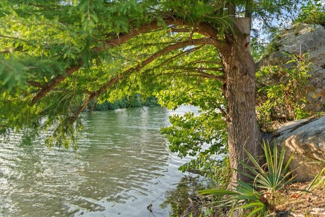 MLS #8499484 for Sale at 202 Hub Dr, on Blanco River in the city of Wimberley, 78676