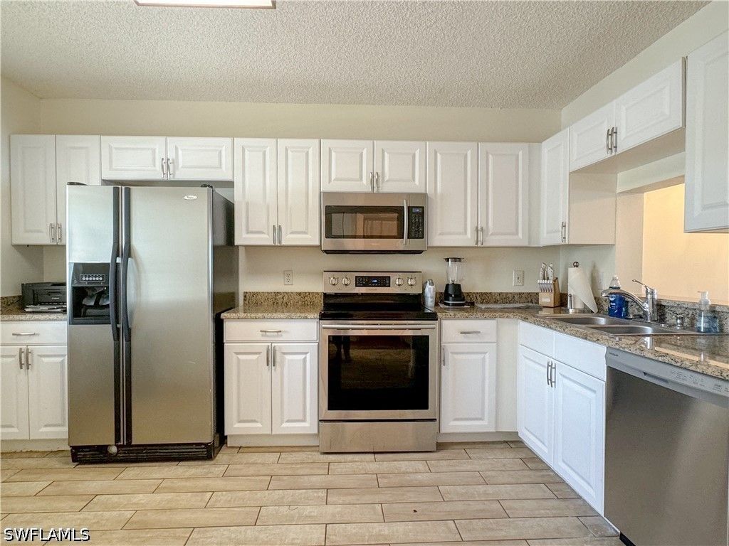 7794 Emerald Cir A-102, Naples