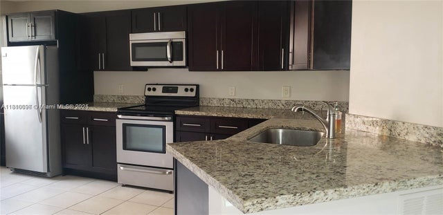 2 of 12 - 8977 Wiles Rd 108, Coral Springs, FL